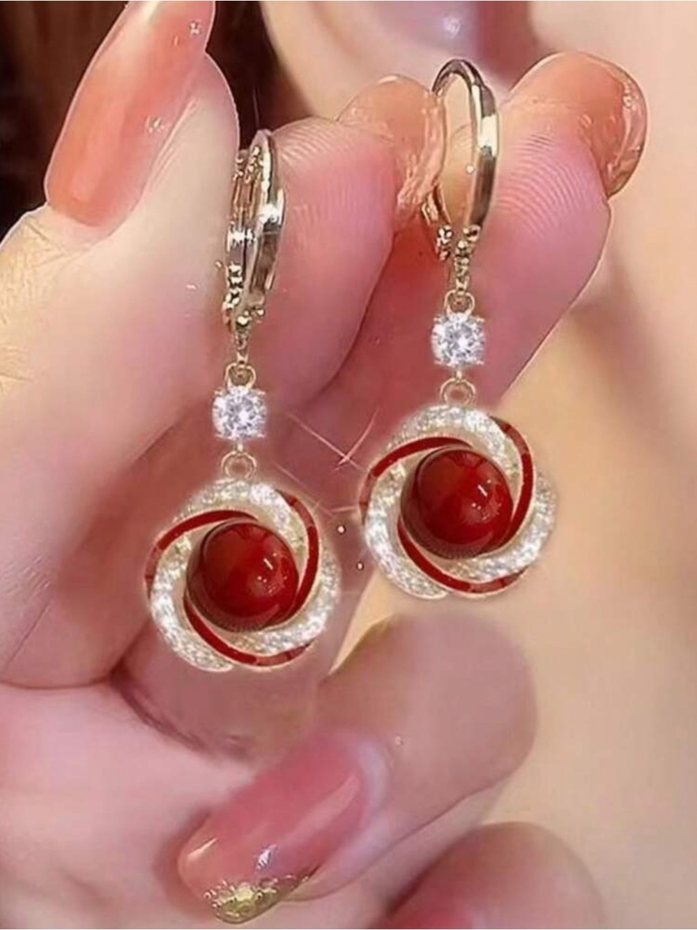 Others Follow Red Crystal Swirl Drop Earrings with Gold Accents